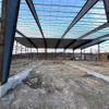 2025 Warehouse Expansion Update the Roof Sheeting Two Bays Left Ridge Caps Are Being Added and Sidewall Sheeting Is Underway