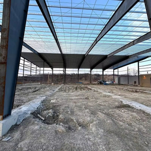 2025 Warehouse Expansion Update the Roof Sheeting Two Bays Left Ridge Caps Are Being Added and Sidewall Sheeting Is Underway