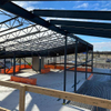 2025 the Airport Structure Is Complete, and Work Is Underway on Exterior Envelope Scopes, Including Metal Roofing and Paneling