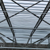 2025 Warehouse Storage Expansion Update Progress First Section Sheeted, 10 Doors Installed, Roof Bands and Cables in Place