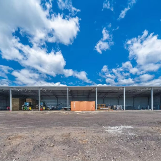 2025 Two Large Farm Sheds Building Measuring Curved Roof Dairy Barn Machinery Shed Size of 144m X 50m X 6m Are Well Underway