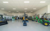 2025 the Layout Included a Showroom Workshop Office Space Staff Amenities and Wash Bay Parking Outdoor Displays and Landscaping