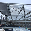 2025 Warehouse Storage Expansion Update Progress First Section Sheeted, 10 Doors Installed, Roof Bands and Cables in Place
