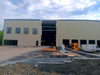 2025 Making Strides on Factory Workshop Project Adding Endwall Insulation Downspouts to Building Getting Closer to Completion